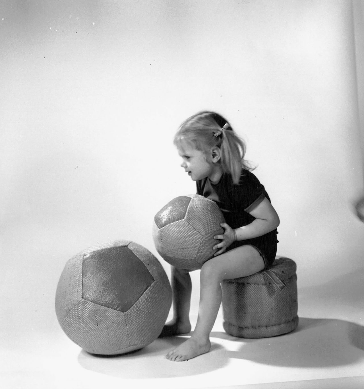 Original photograph of a child demonstrating Müller’s Balls and Small Roll