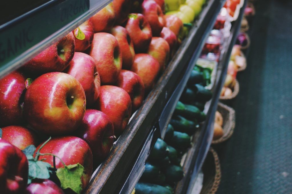 Apples in a supermarket  Photo by Alina Grubnyak on Unsplash 