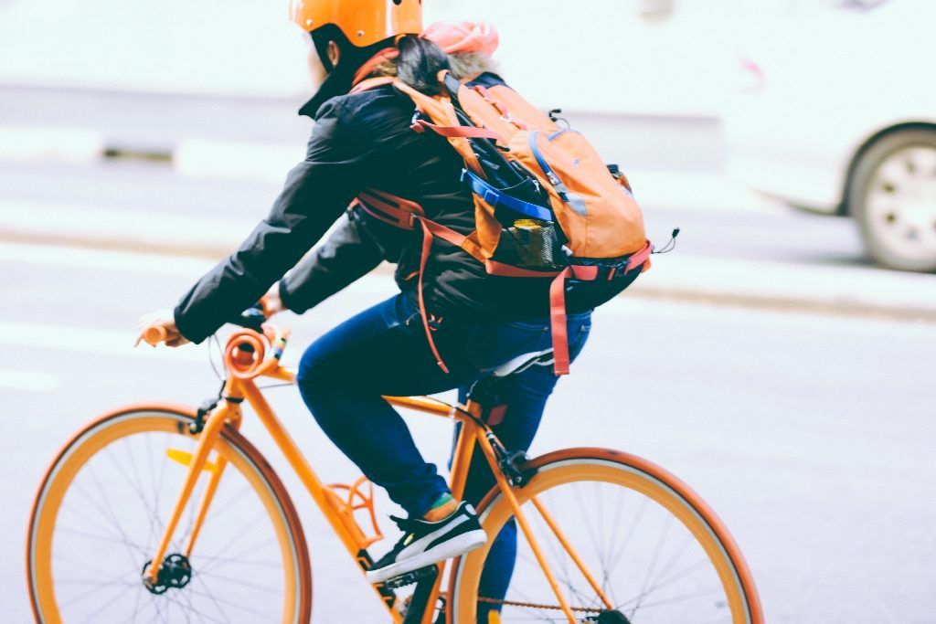 Man on a bike going about his work