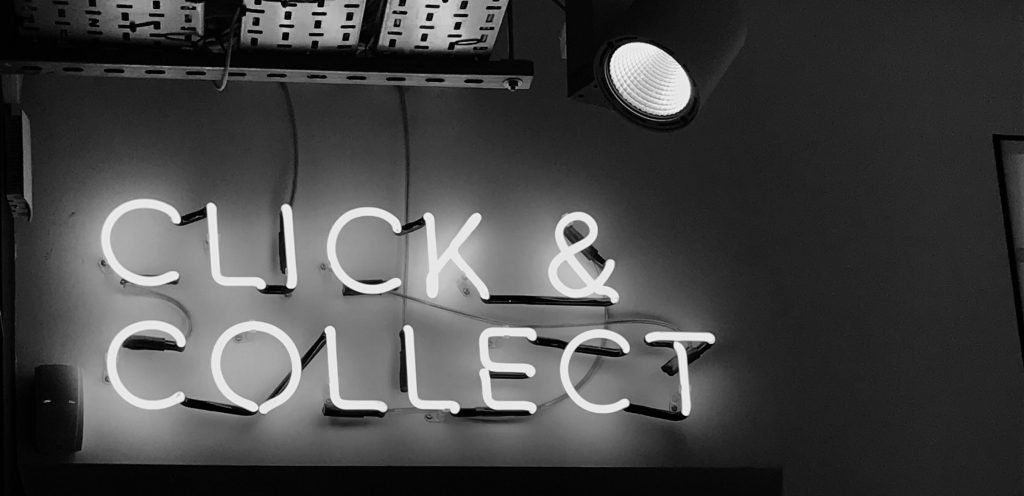 A 'Click & Collect' sign lit up
Photo by Henrik Dønnestad on Unsplash