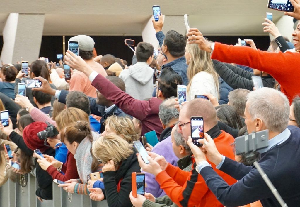 A crowd full of photographers at an event Photo by Barbara Provenzano on Unsplash