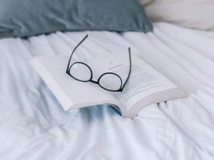 glasses on top of book