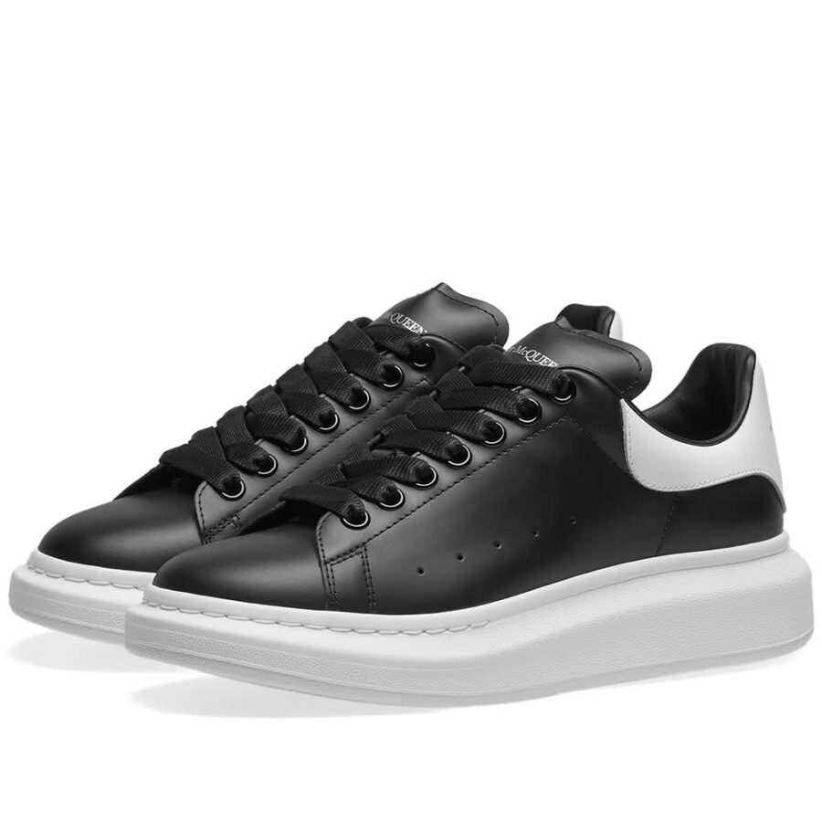 black trainers with white soles