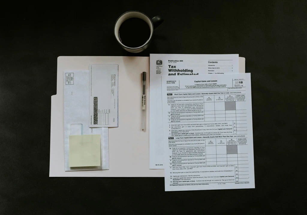 Open folder with paperwork and a pen on a desk, symbolizing organized templates.
