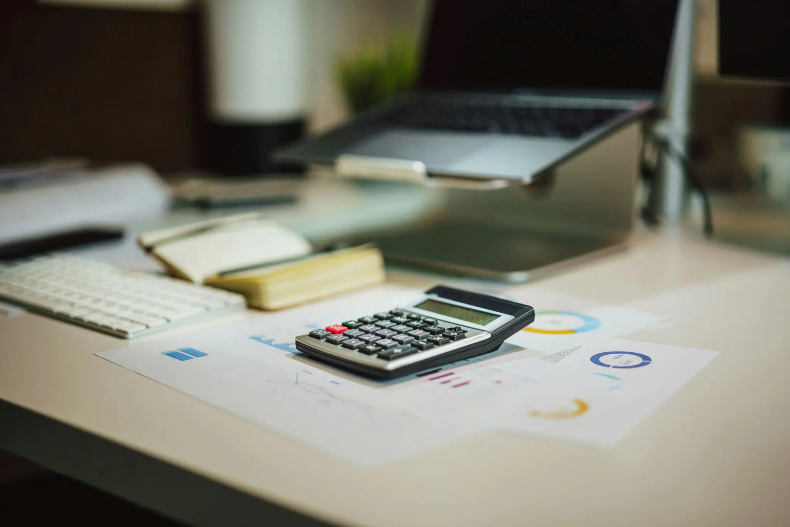 Calculator and documents — an example of calculating the net payout after deductions.