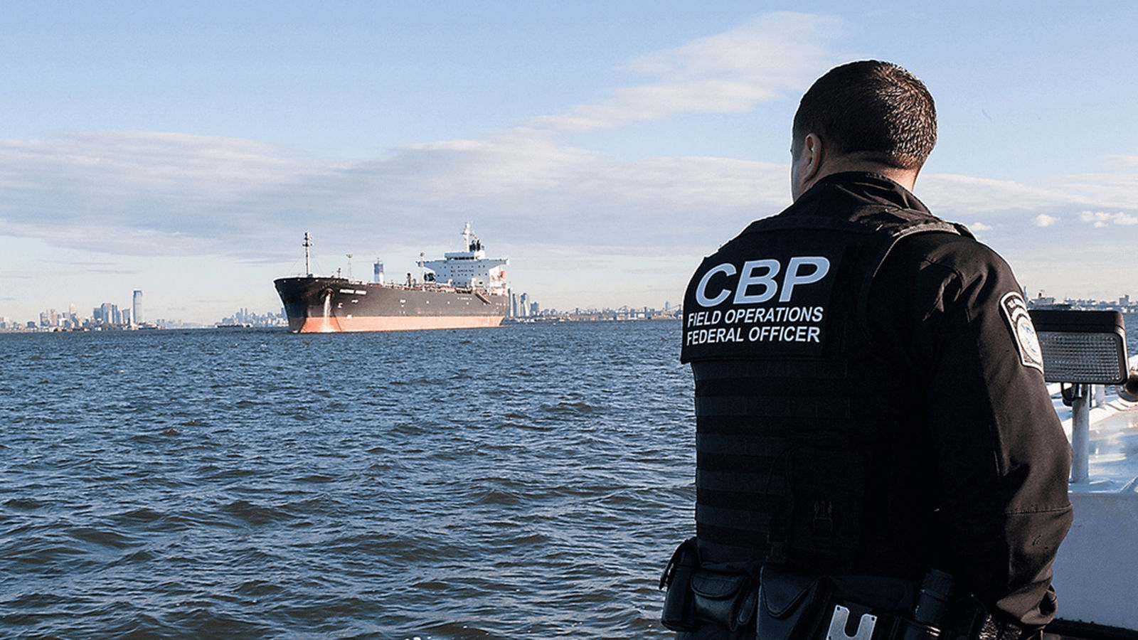 U.S. Customs and Border Protection officers at a port of entry enforcing import rules and tariffs