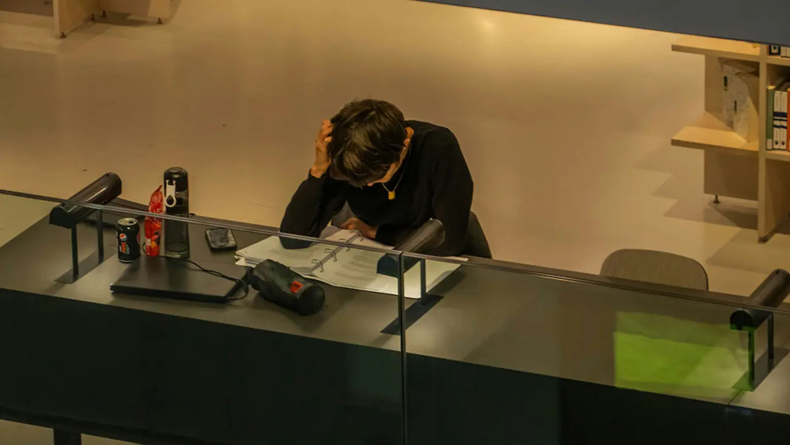 Person reading contract papers at a desk, preparing for a white label deal.