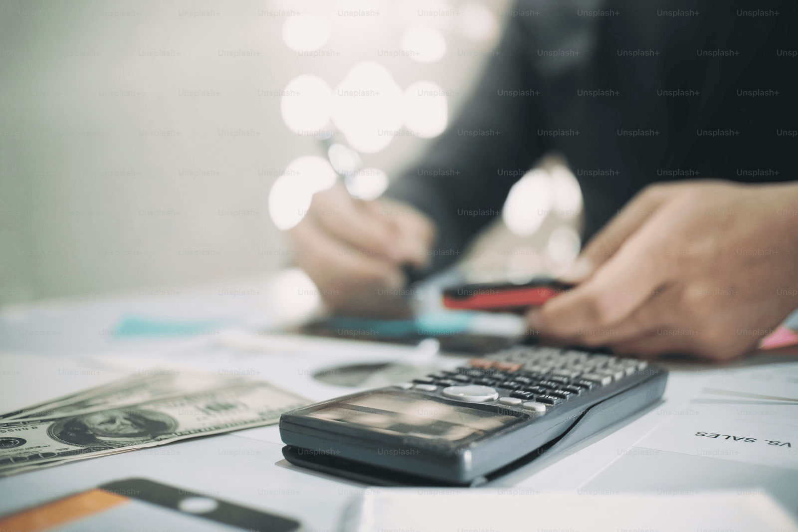 Financial documents and calculator showing probate-related expenses