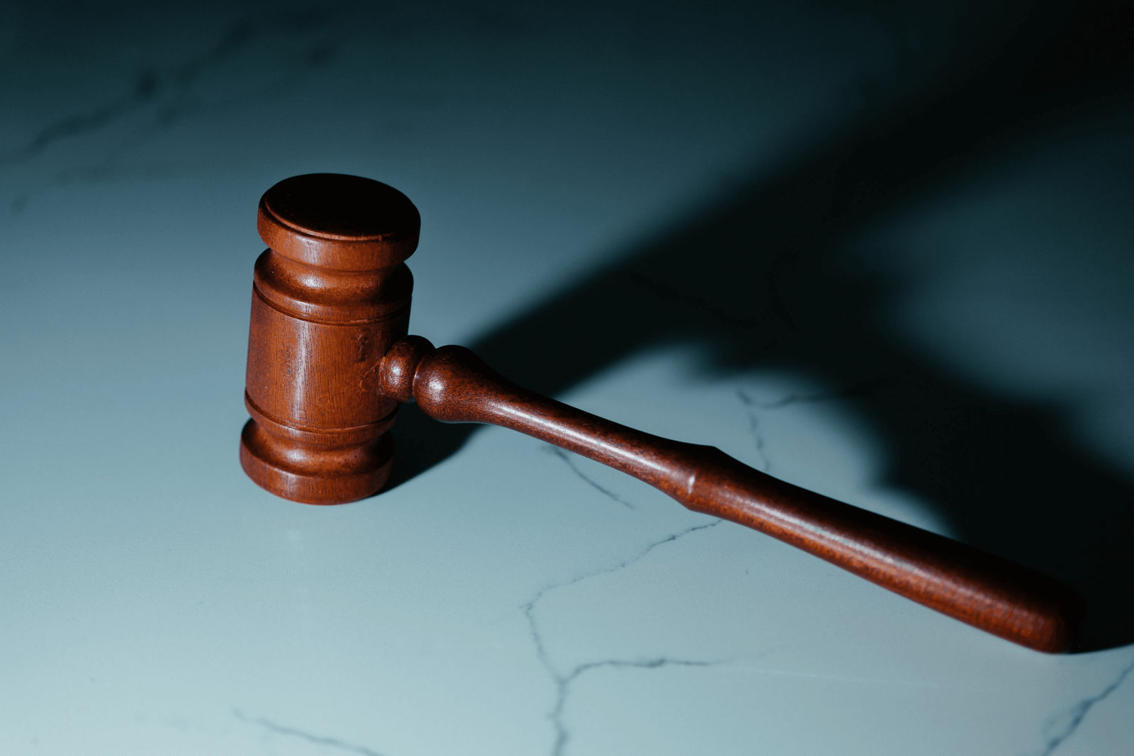 Legal documents, gavel, and notepad on desk - symbolizing criminal defense preparation and legal strategy