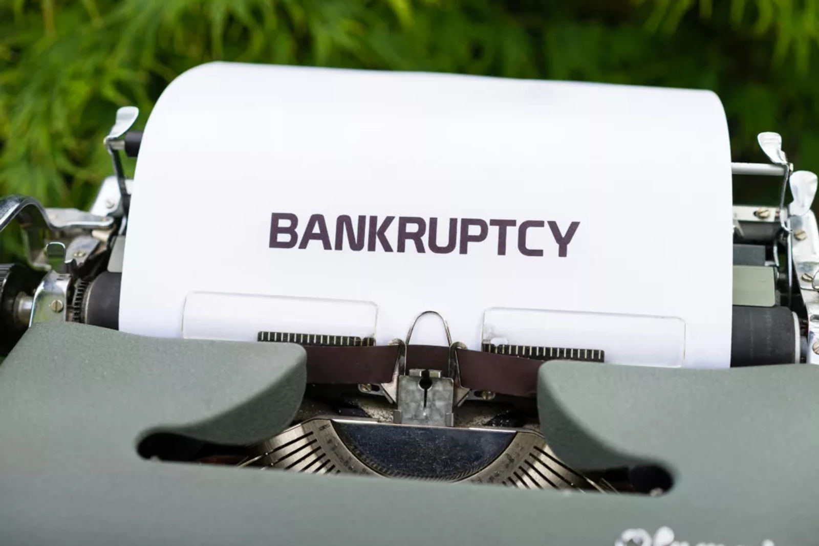 Paper with the word 'Bankruptcy' typed on a typewriter.