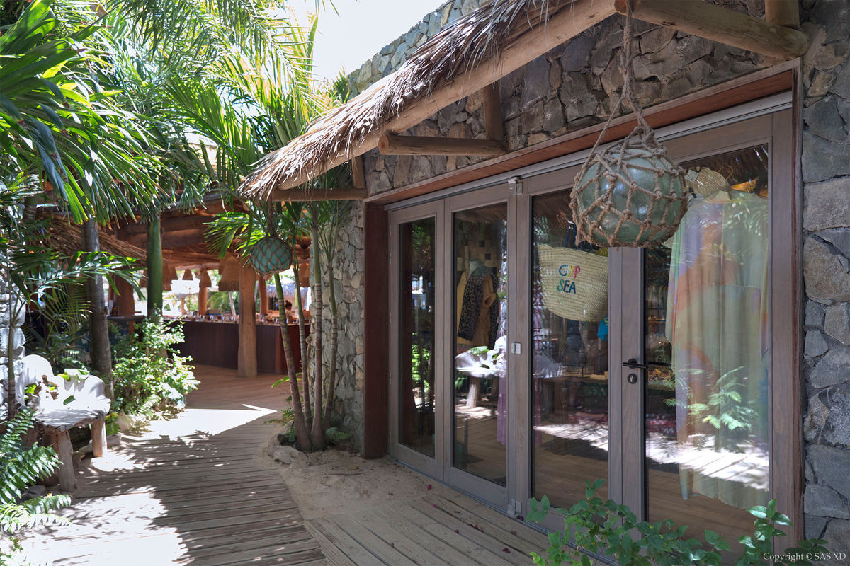 Boutique (and other permanent structures) built in concrete & stone define the land-side entry and are set back from the beach to reduce the impact of ocean surge damage in the case of tropical storm or hurricane.