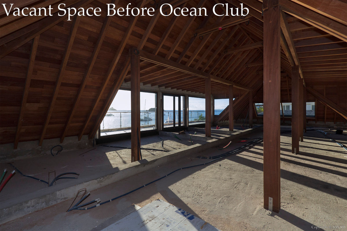 Vacant original suite featuring the exposed timber of a large hip roof before arrival of the Ocean Club as tenant. 