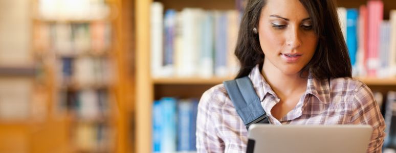 Woman looking at laptop