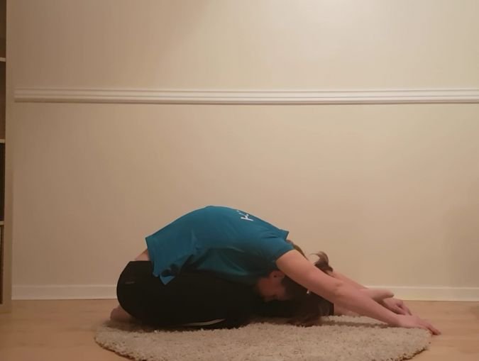 women leaning forward stretching leg