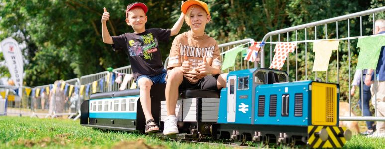 Children riding miniature railway 