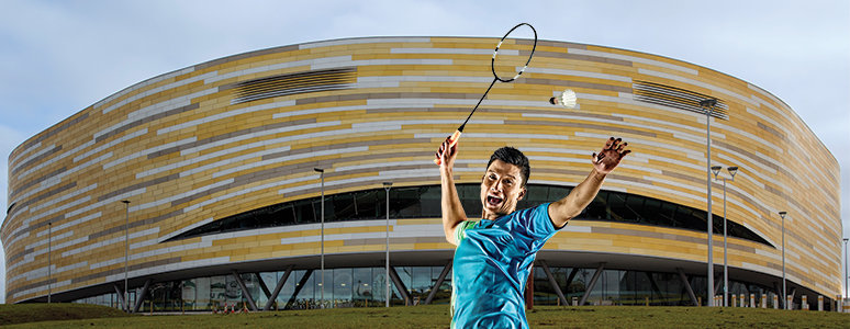 Badminton player in front of Derby Arena