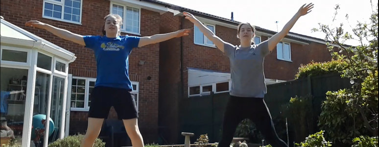 two girls jumping into star shapes