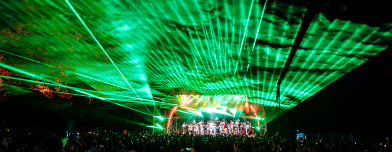 Green lasers over an outdoor concert