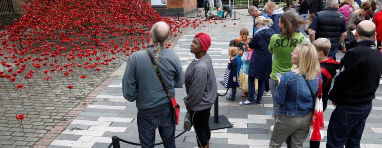 Poppies: Weeping Window sculpture with visitors