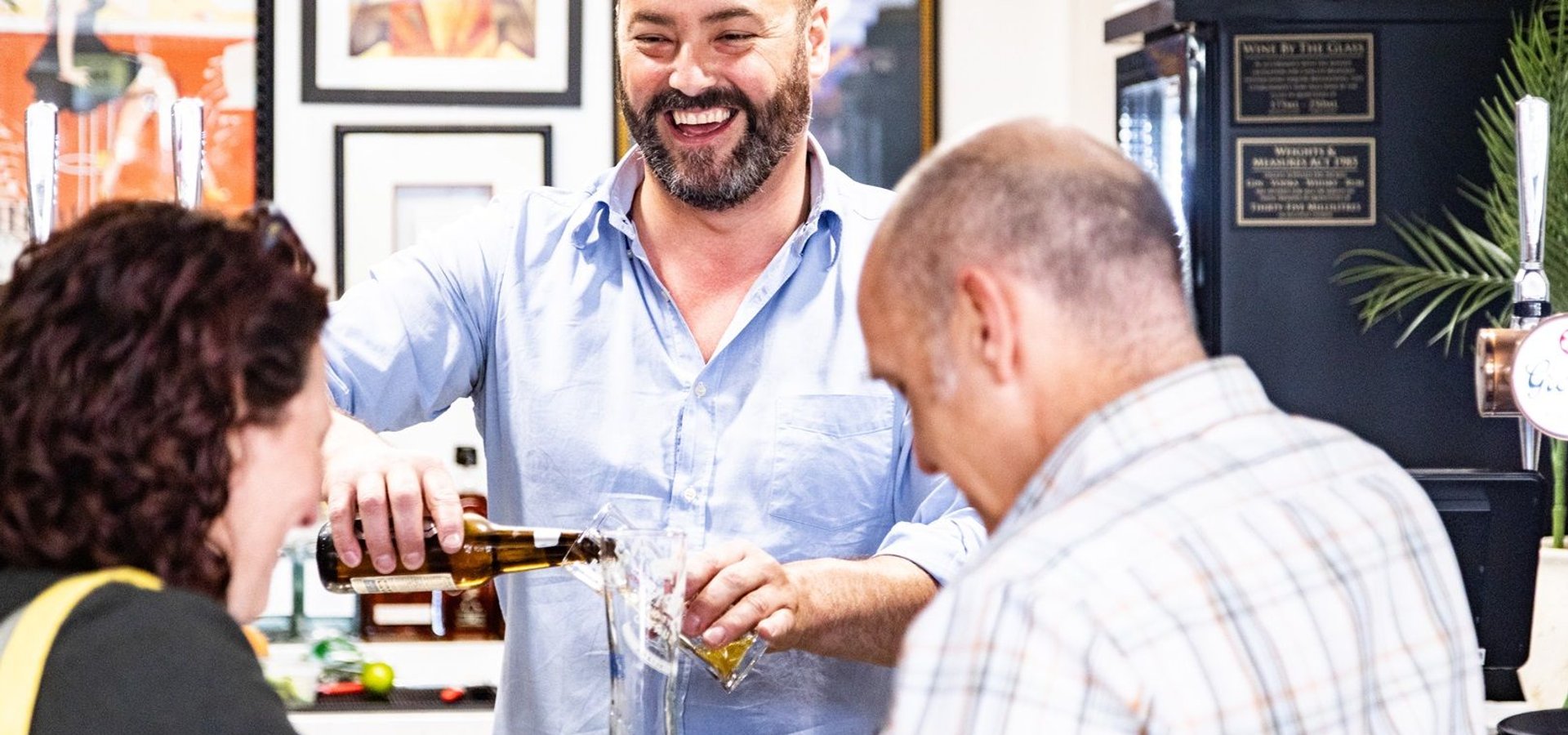 Bartender serving drinks at Market Porter