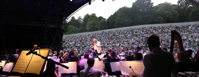 View of the crowd from behind the orchestra enjoying the Darley Park Concert.