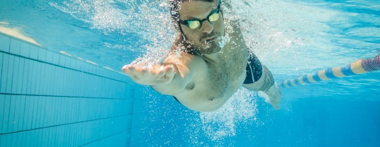 Man swimming in pool