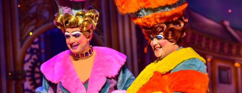 Morgan Brind and Roddy Peters stand dressed as the Ugly Sisters.