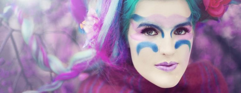 Singer songwriter Lucy Ward in exotic make up and blue hair