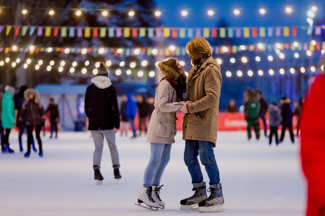 Couple on ice rink being romantic