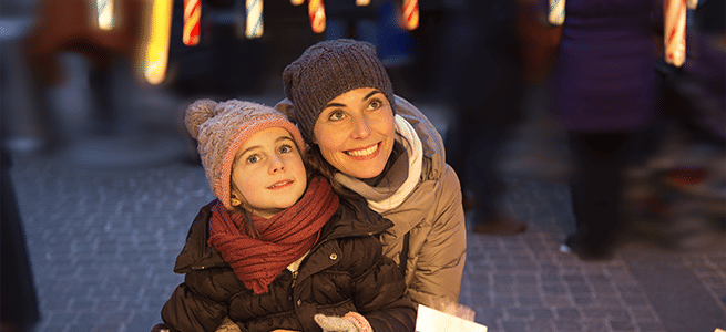 Mother and child looking in wonder in a shop window