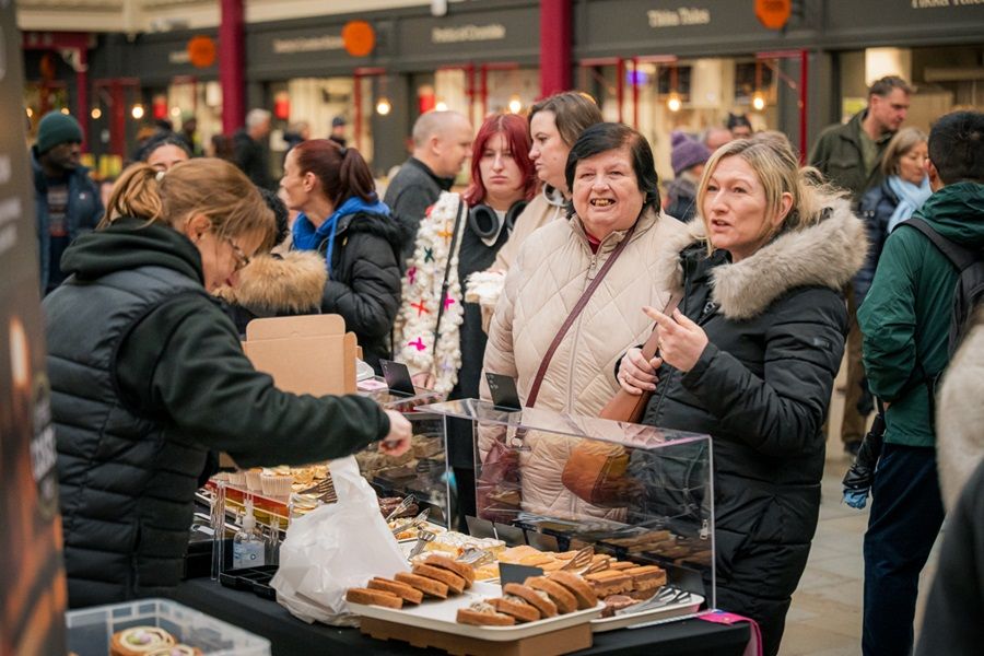 Shoppers buying baked goods