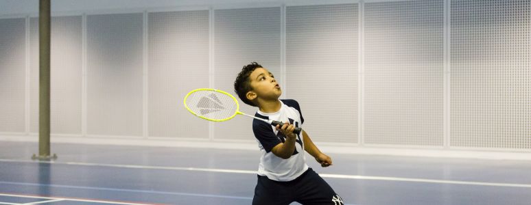 Boy playing badminton