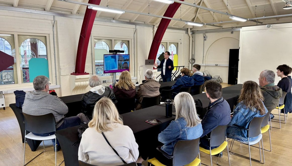 Attendees and speaker at meeting in Derby Market Hall Ordish Room
