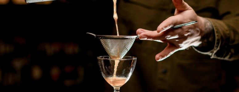 Bartender serving cocktail