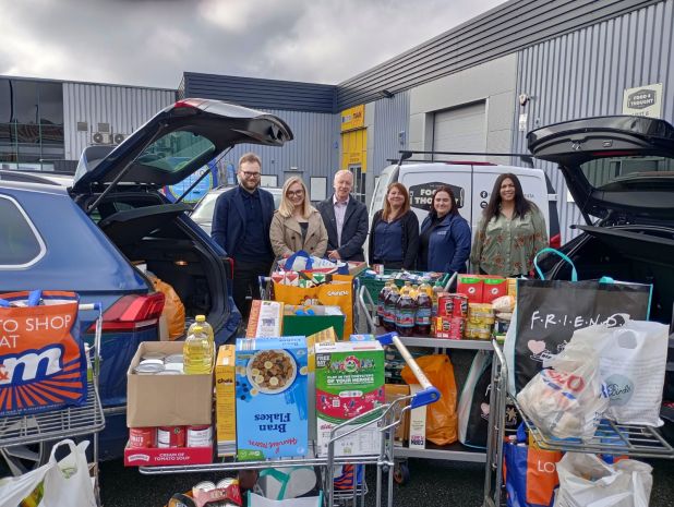 Employees from Armslow delivering food donations