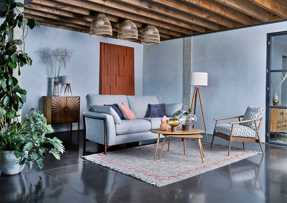 Avanti medium sofa in N118 fabric and an Aldbury chair in E727 fabric, both in DK finish, along with the Pebble coffee table in OG finish Avanti medium sofa in N118 fabric and an Aldbury chair in E727 fabric, both in DK finish, along with the Pebble coffee table in OG finish