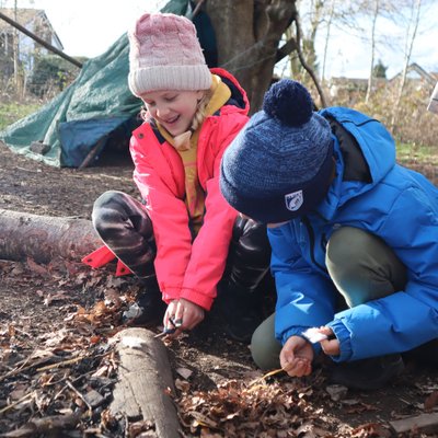 child trying to fire light with flint and steel