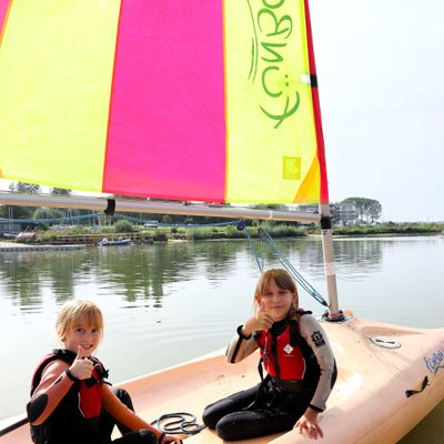 thumbs up from children in funboat