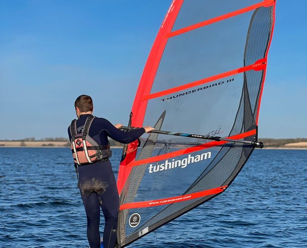 man windsurfing