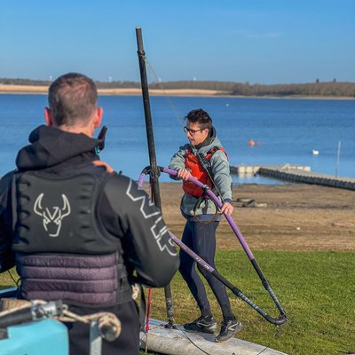 instructor teaching windsurfing