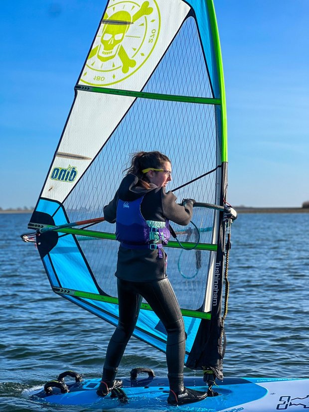 girl windsurfing