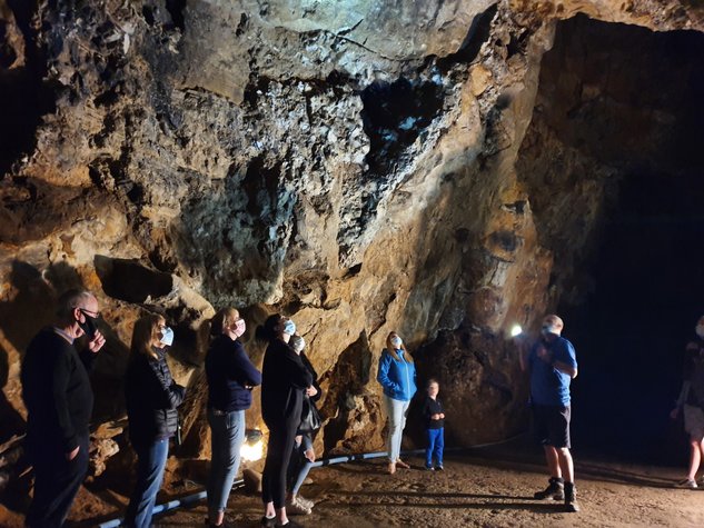 Tour group wearing face masks, inside Masson cavern