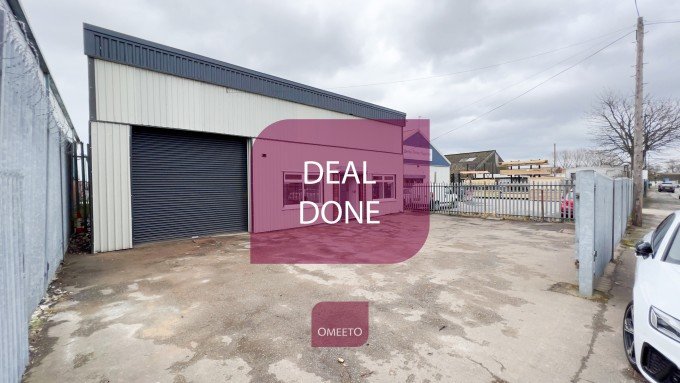 Image of deal being done by Derby team