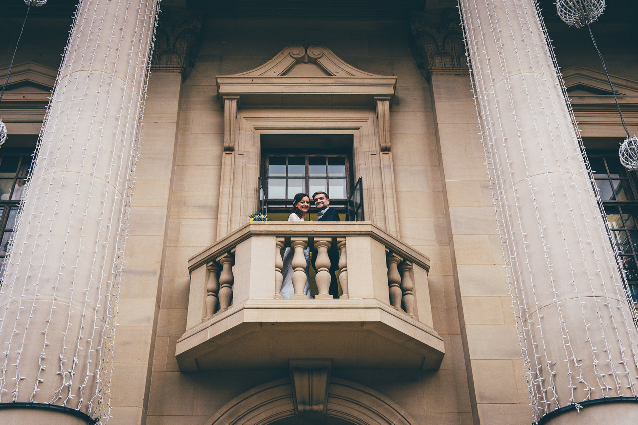 Bride and groom on balcony of the Council House Derby