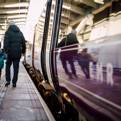 Father and son on platform exiting East Midlands Train 