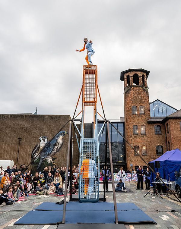 A Derby Feste act outside the Museum of Making