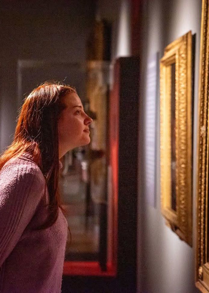 A couple sat in the Joseph Wright gallery