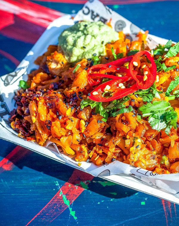 Close up image of a delicious looking dish with chillies on the top