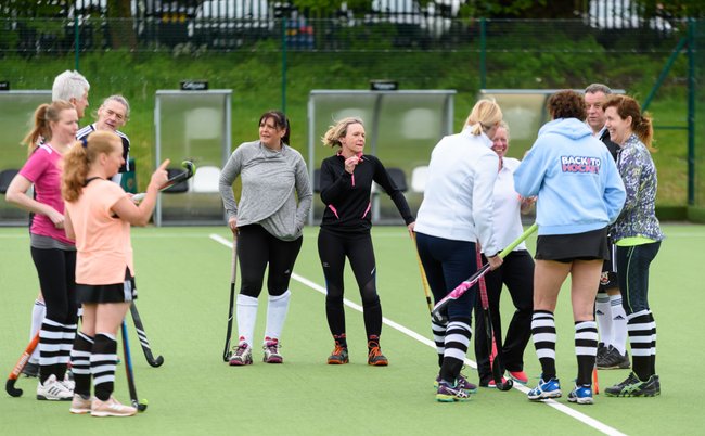 Group of people at the start of a hockey session