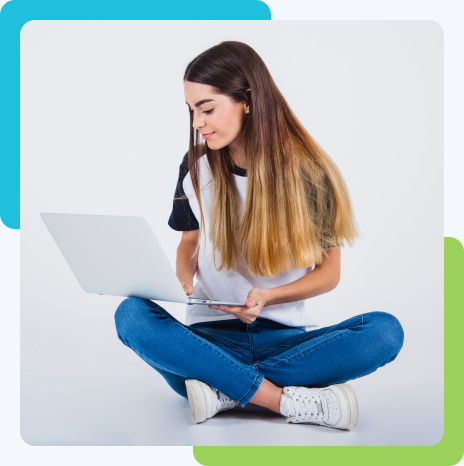 A girl browsing the internet on her laptop.